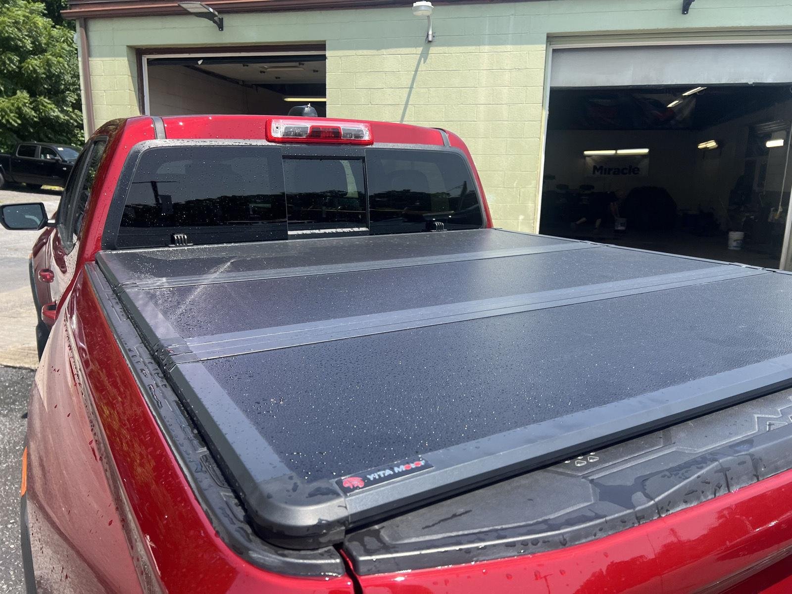 Used 2024 Volcanic Red Tintcoat GMC 4WD AT4 image 5