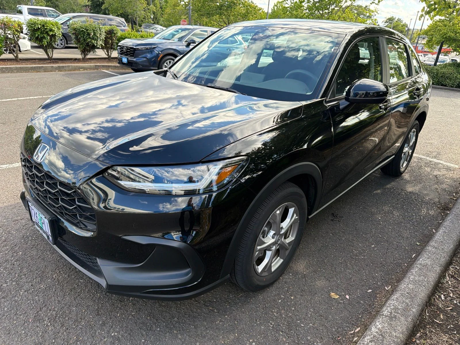 Used 2024 Crystal Black Pearl Honda LX image 1