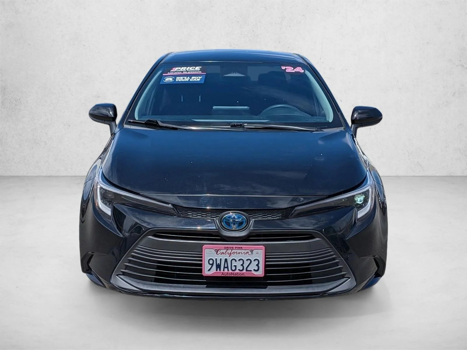 Used 2024 Midnight Black Metallic Toyota Hybrid LE image 2
