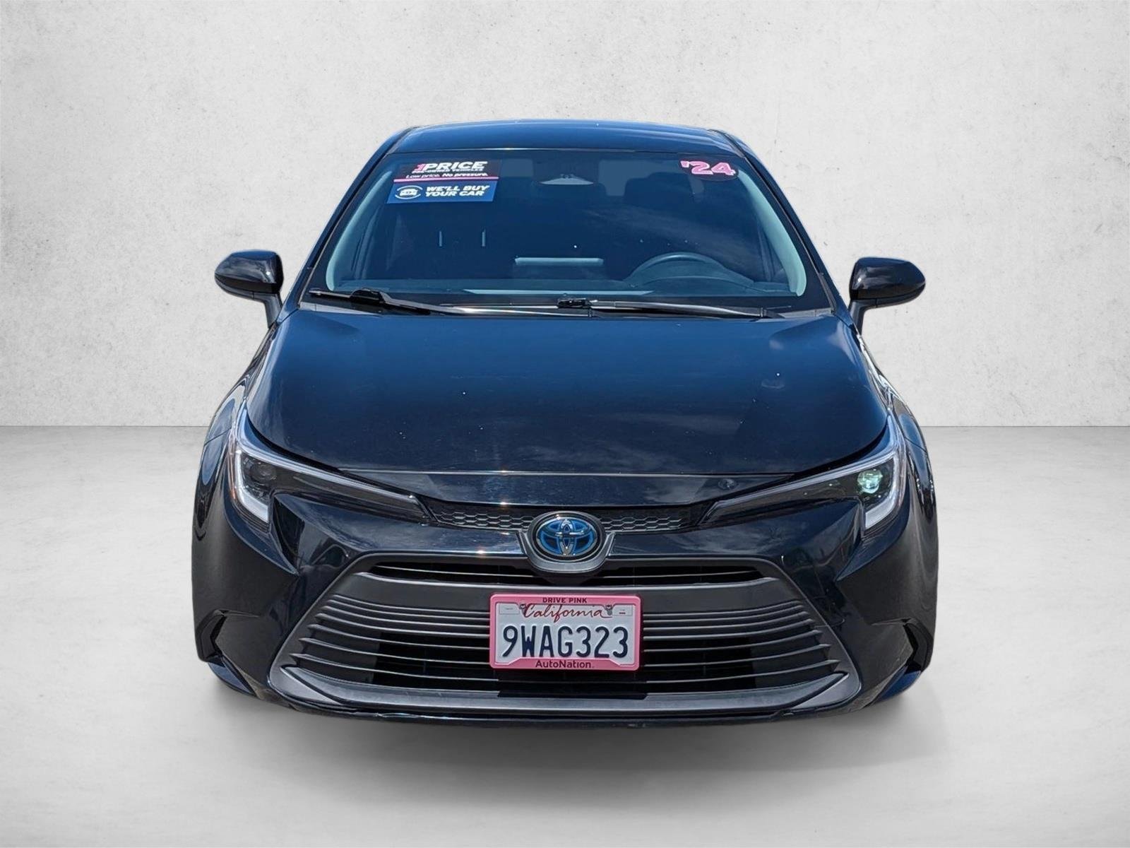 Used 2024 Midnight Black Metallic Toyota Hybrid LE image 2