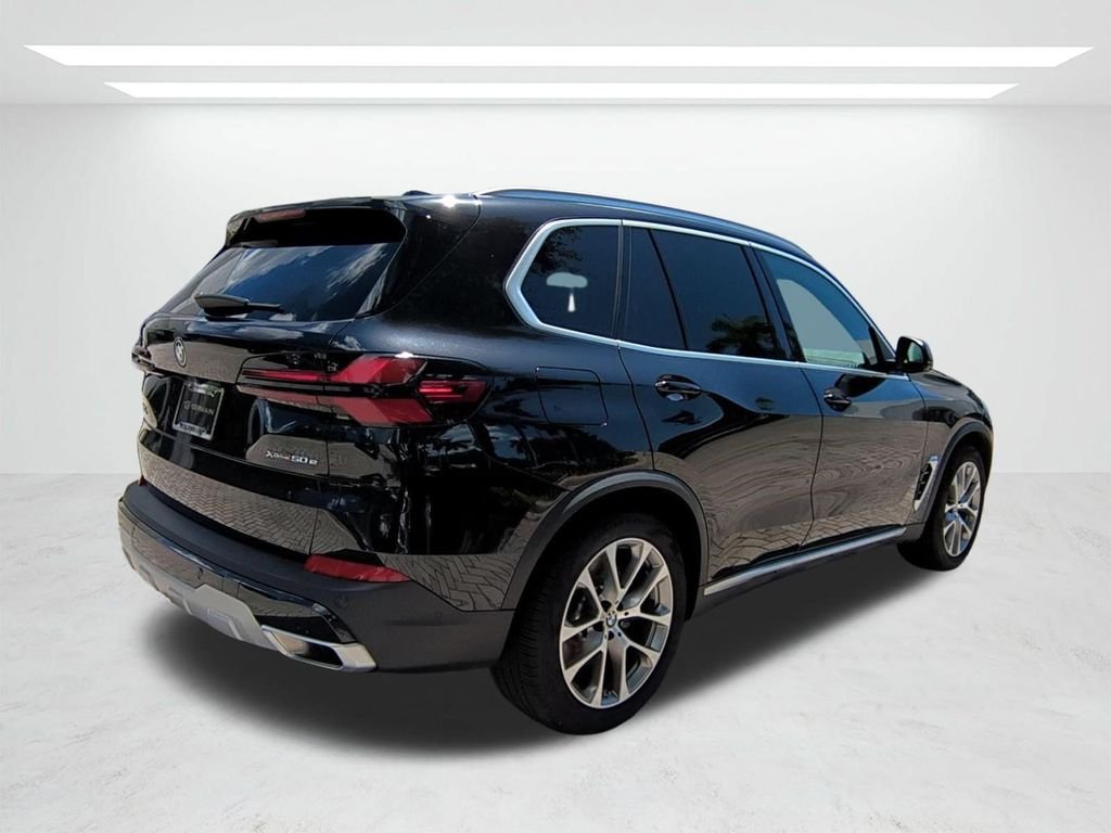 New 2026 Black Sapphire Metallic BMW xDrive50e image 4