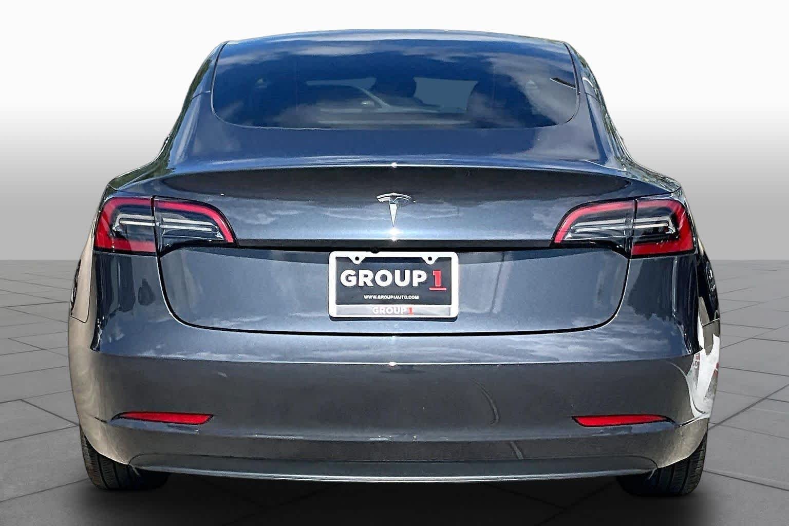 Used 2023 Solid Black Tesla  image 4