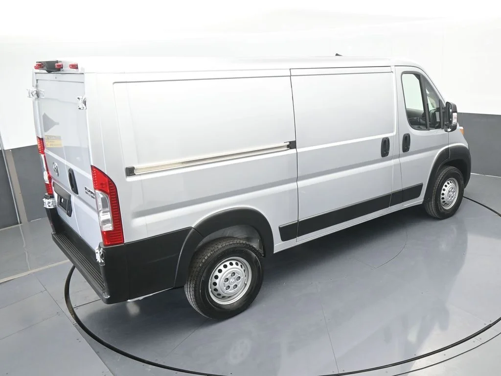 Used 2025 Bright Silver Clearcoat Metallic Ram Low Roof image 42