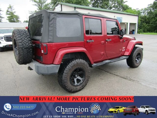 Used 2013 Red Jeep Unlimited Sahara image 4