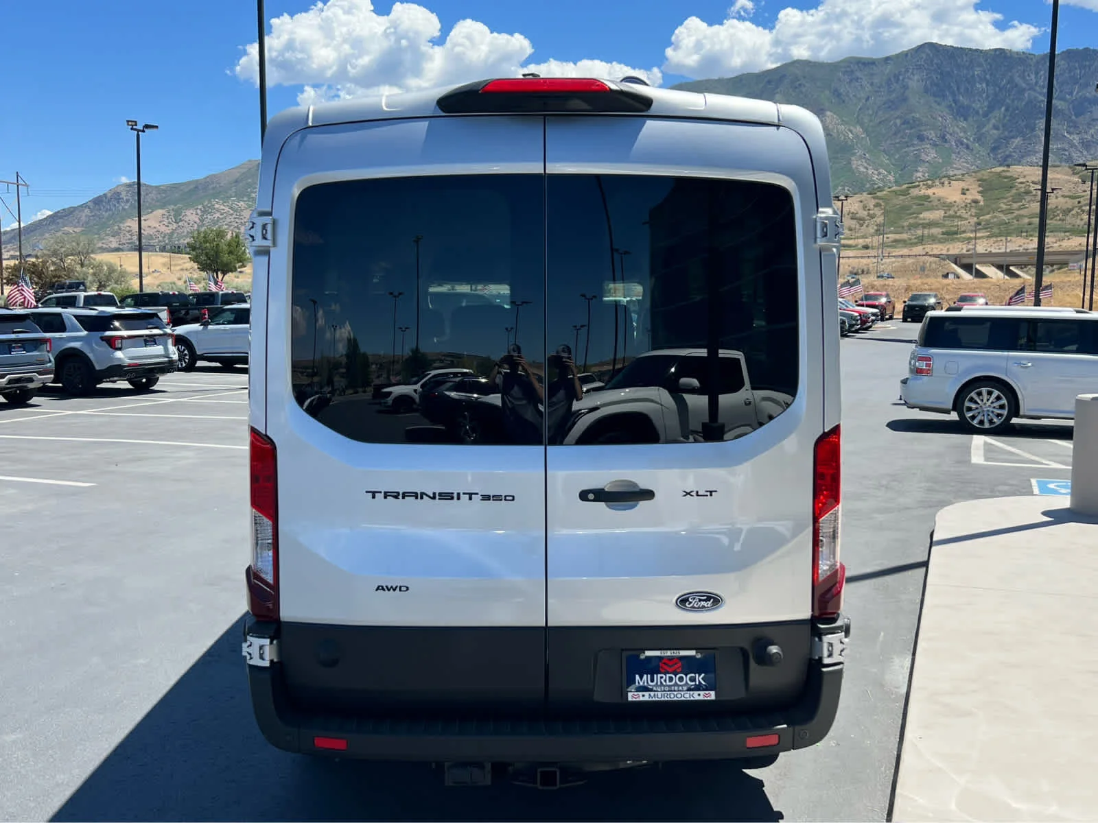 New 2026 Ingot Silver Metallic Ford Passenger Van XLT image 9