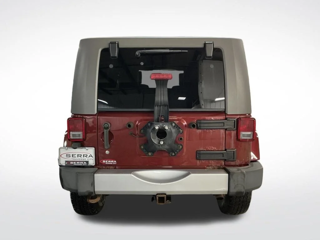 Used 2010 Red Jeep Unlimited Sahara image 4
