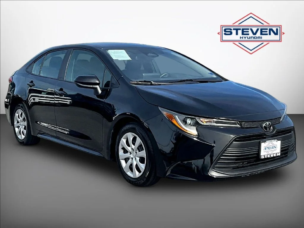 Used 2024 Black Toyota LE image 1