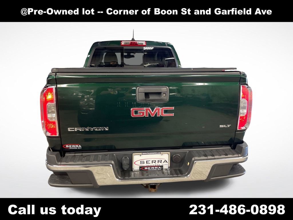 Used 2016 EMERALD GREEN METALLIC GMC 4WD SLT image 4
