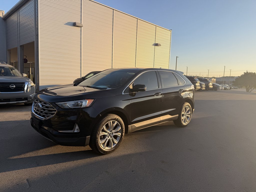 Used 2019 Agate Black Metallic Ford Titanium image 1