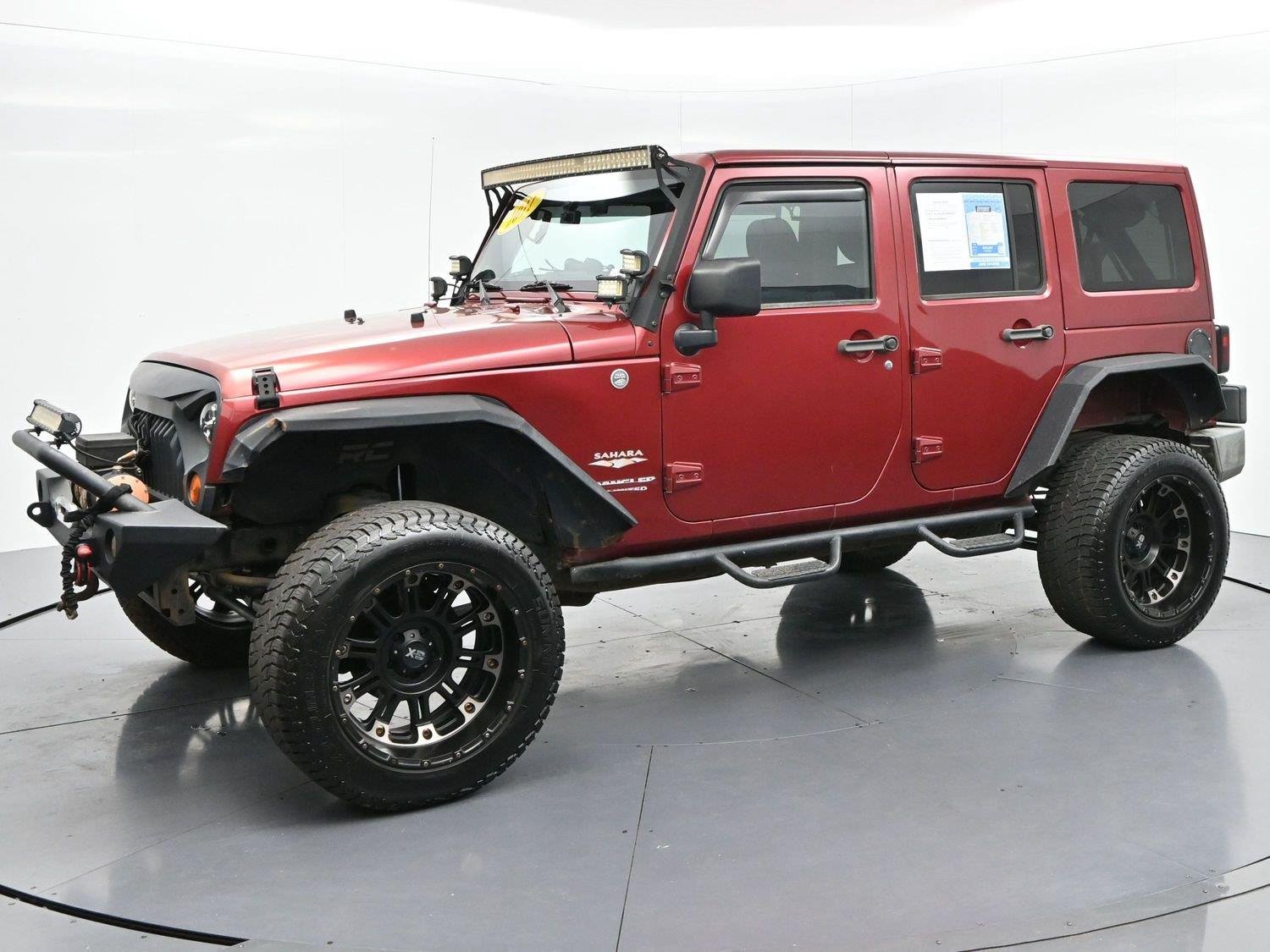 Used 2011 Deep Cherry Red Crystal Pearlcoat Jeep Sahara image 3