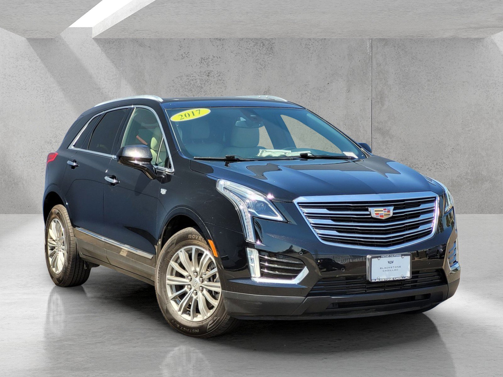 Used 2017 STELLAR BLACK METALLIC Cadillac Luxury FWD image 1