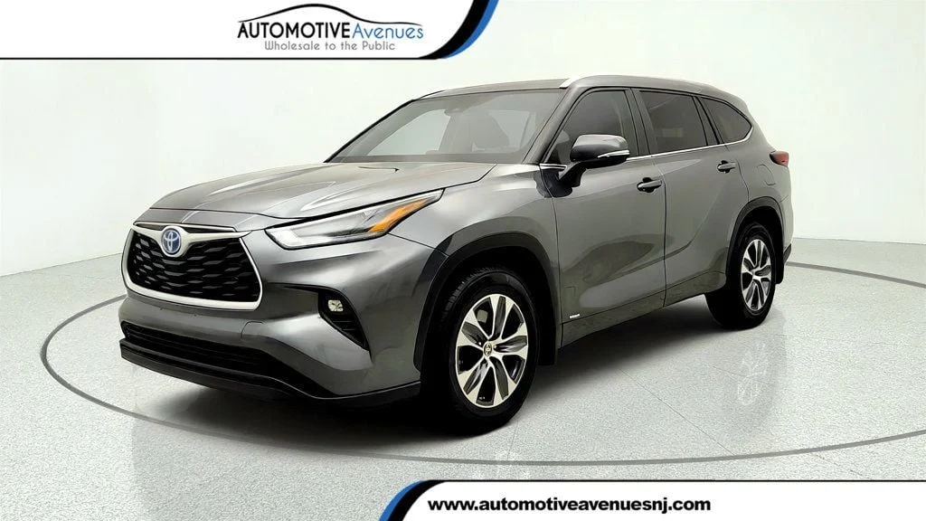 Used 2024 Magnetic Gray Metallic Toyota Hybrid XLE AWD w/ Roof Cross Bars image 1