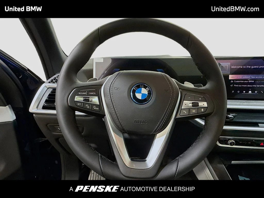 New 2026 Tanzanite Blue II Metallic BMW xDrive50e image 6