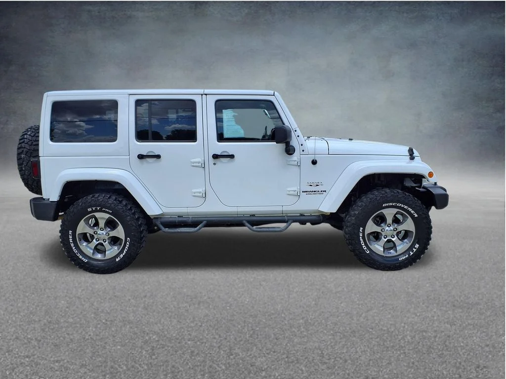 Used 2016 White Jeep Unlimited Sahara image 9