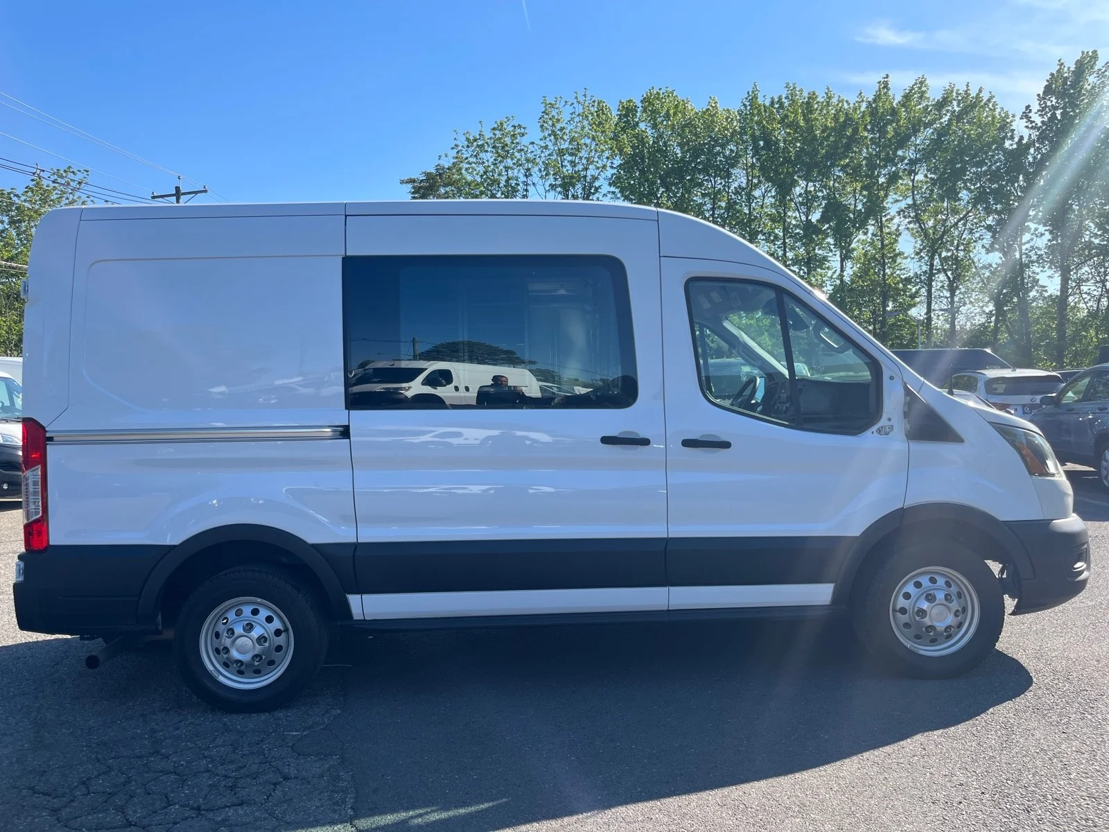 Used 2023 Oxford White Ford T250 MED ROOF AWD image 7