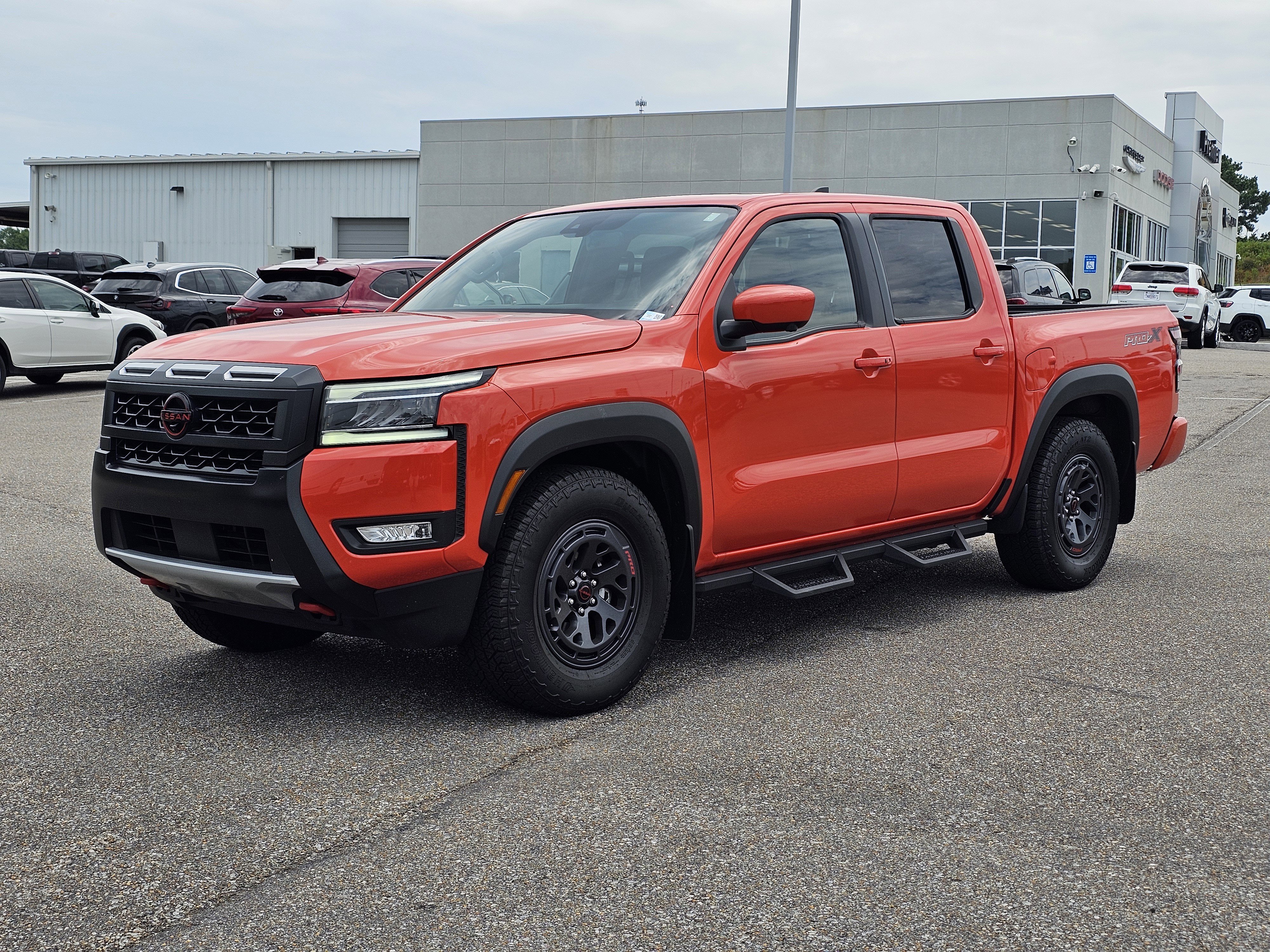 Used 2025 Afterburn Orange Nissan PRO-X image 1