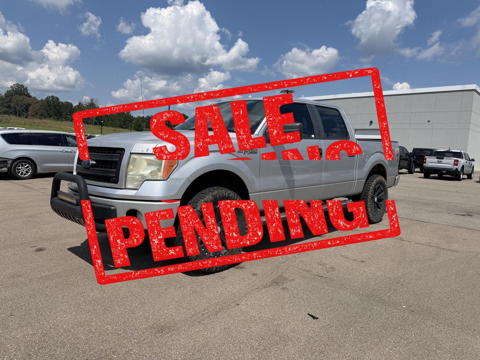 Used 2014 Ingot Silver Metallic Ford STX image 1