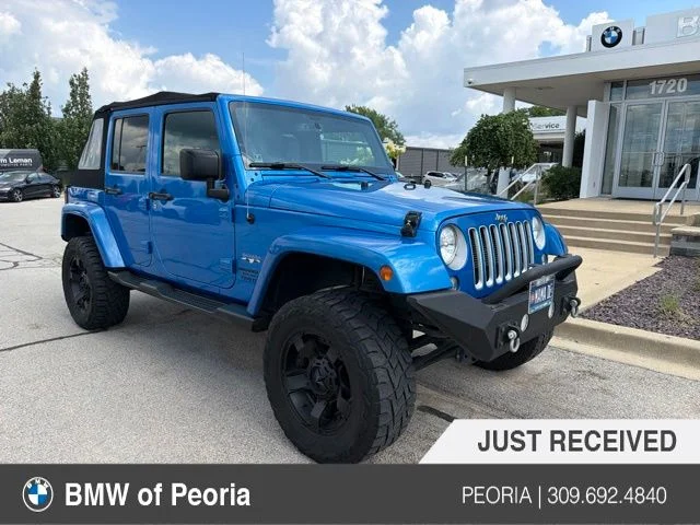 Used 2016 Blue Jeep Unlimited Sahara image 1