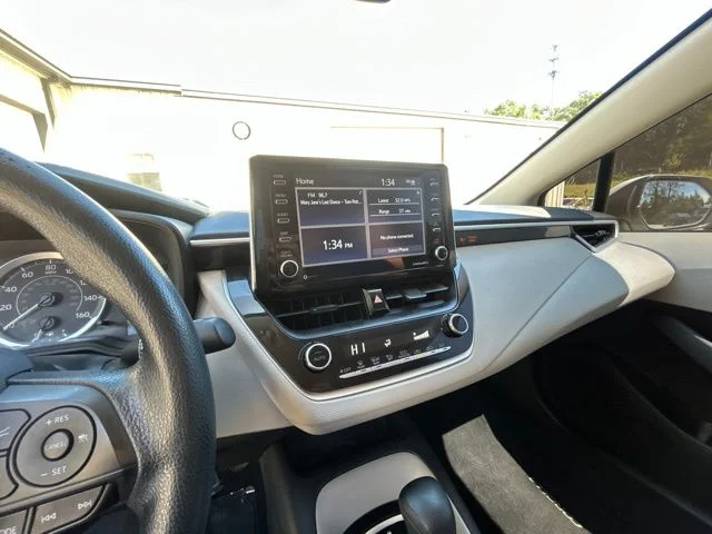 Used 2021 Super White Toyota LE image 23