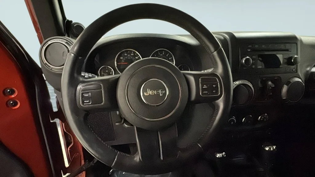 Used 2014 Orange Jeep Unlimited Sport image 24