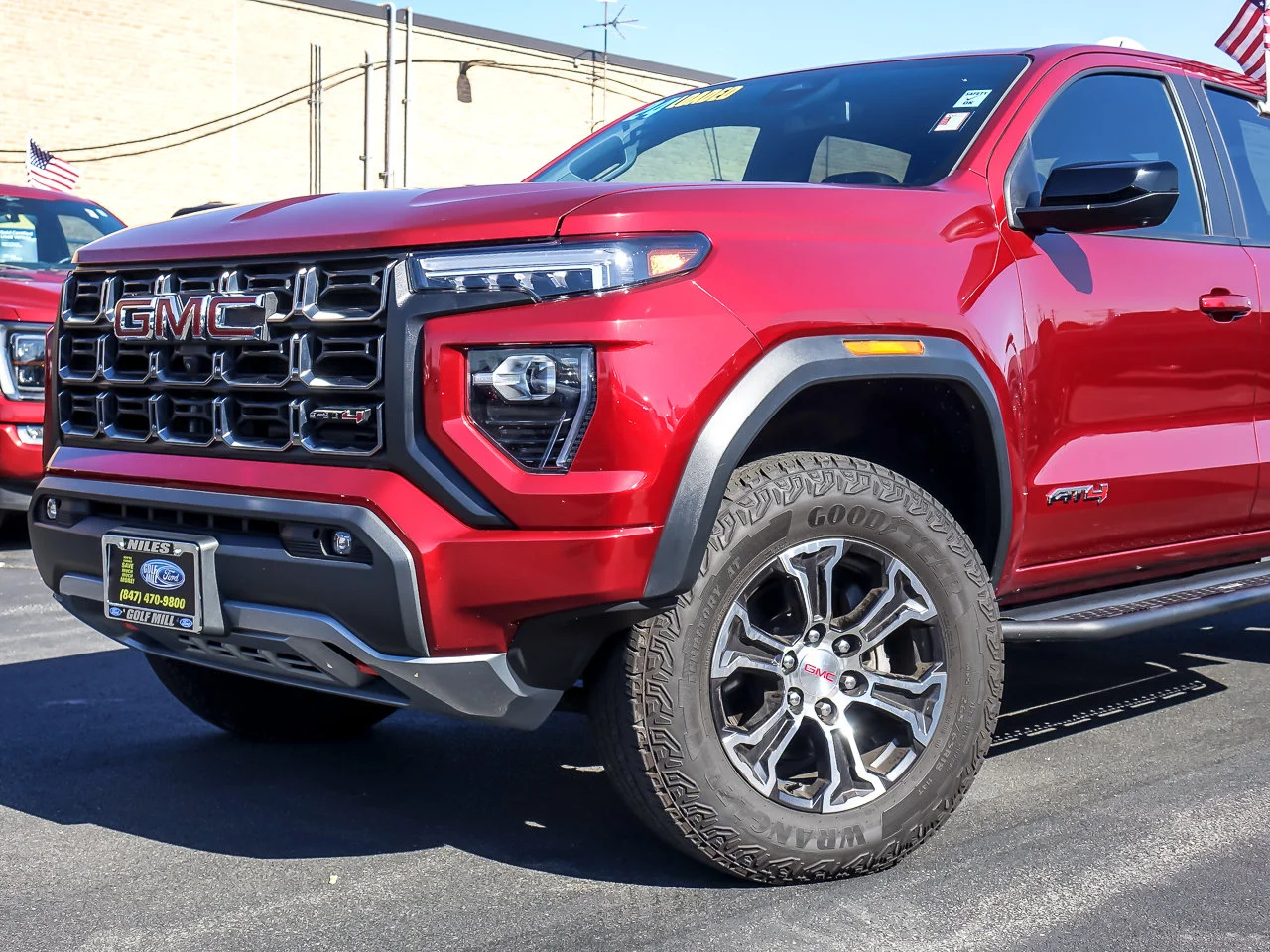 Used 2024 Volcanic Red Tintcoat GMC 4WD AT4 image 1