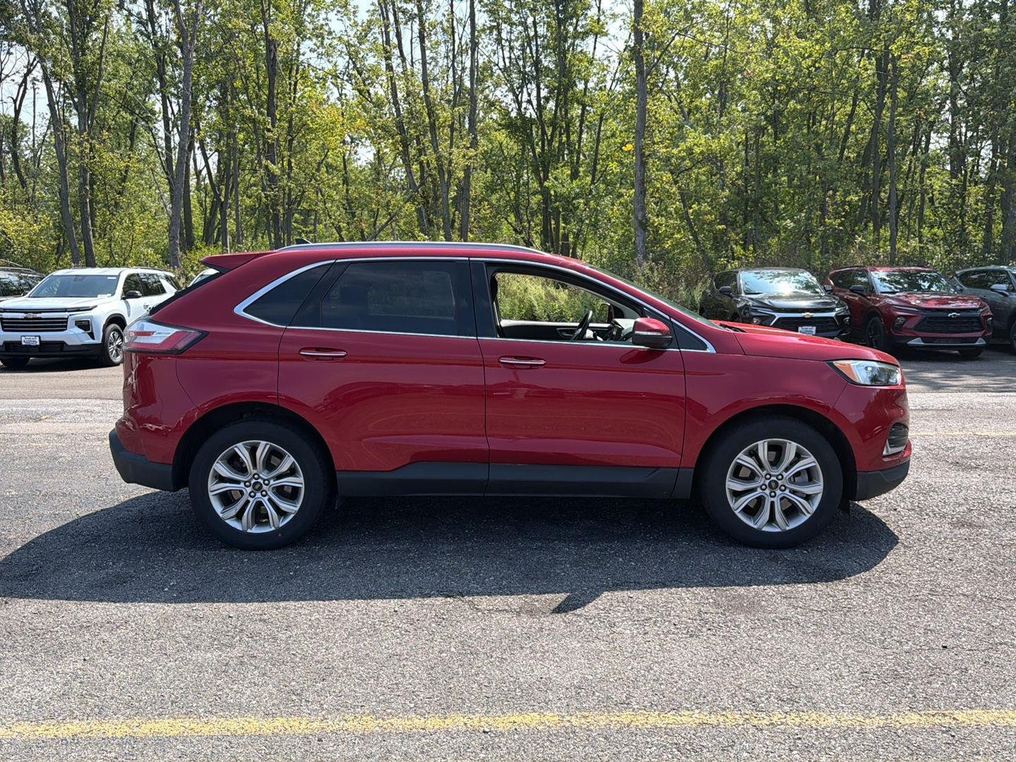 Used 2024 Rapid Red Metallic Tinted Clearcoat Ford Titanium image 2