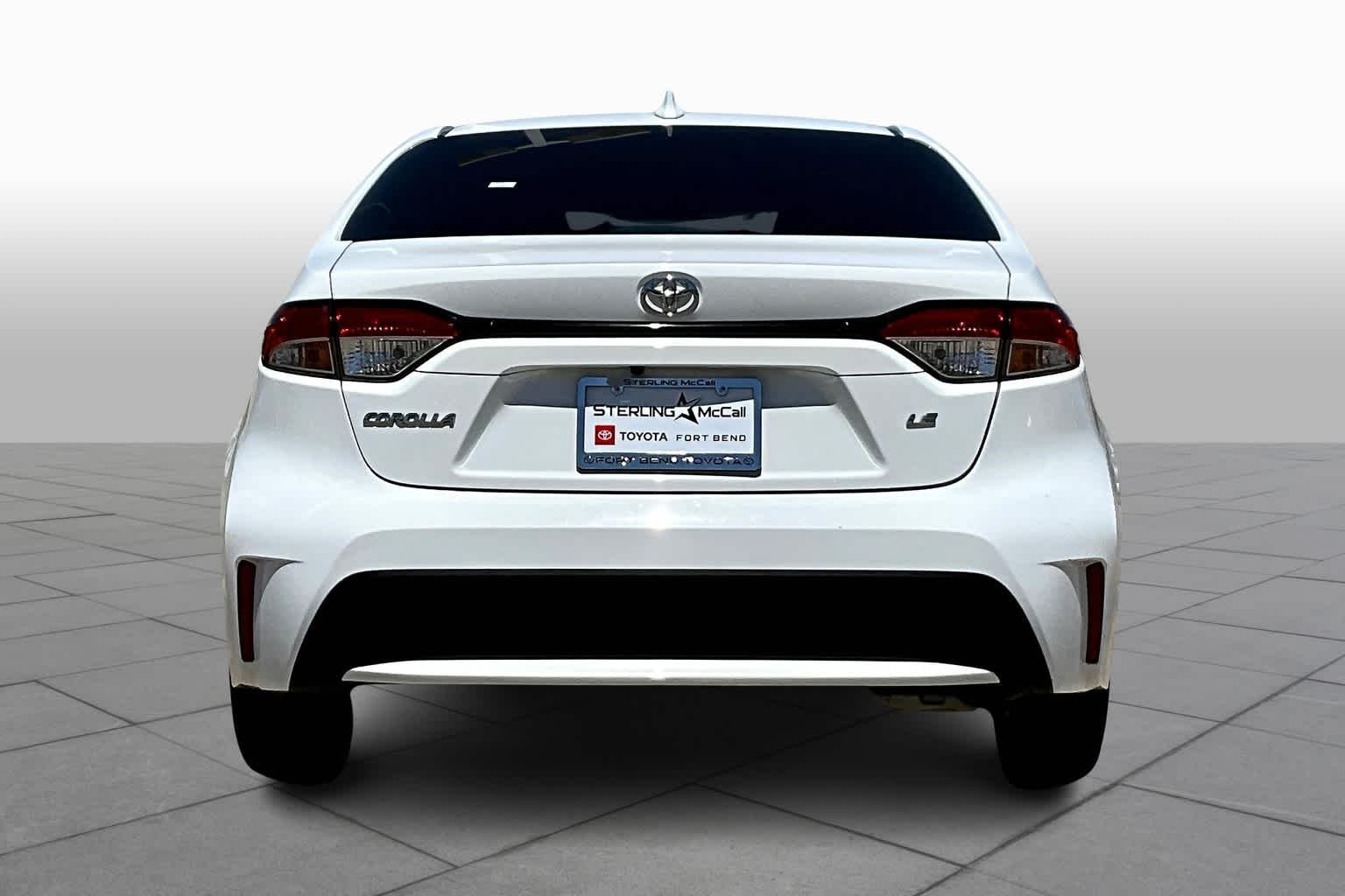 Used 2021 Super White Toyota LE image 5
