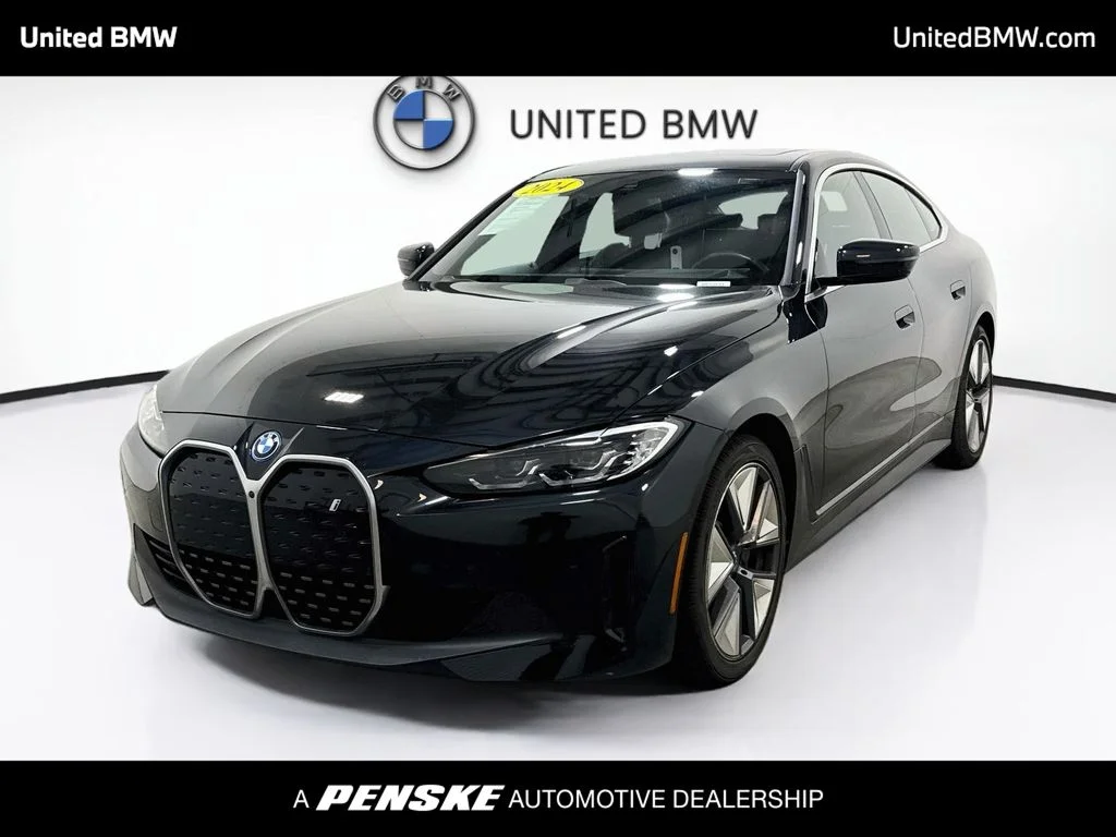 Certified Used 2024 Black Sapphire Metallic BMW eDrive40 image 1