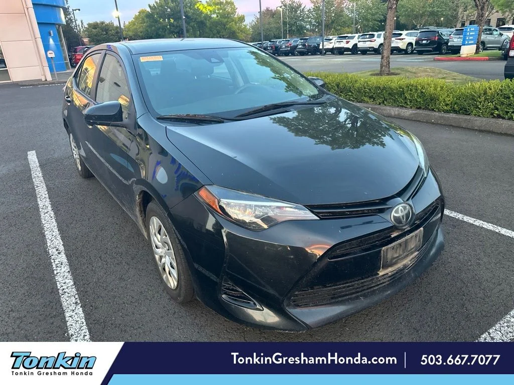 Used 2019 Black Sand Pearl Toyota LE image 1