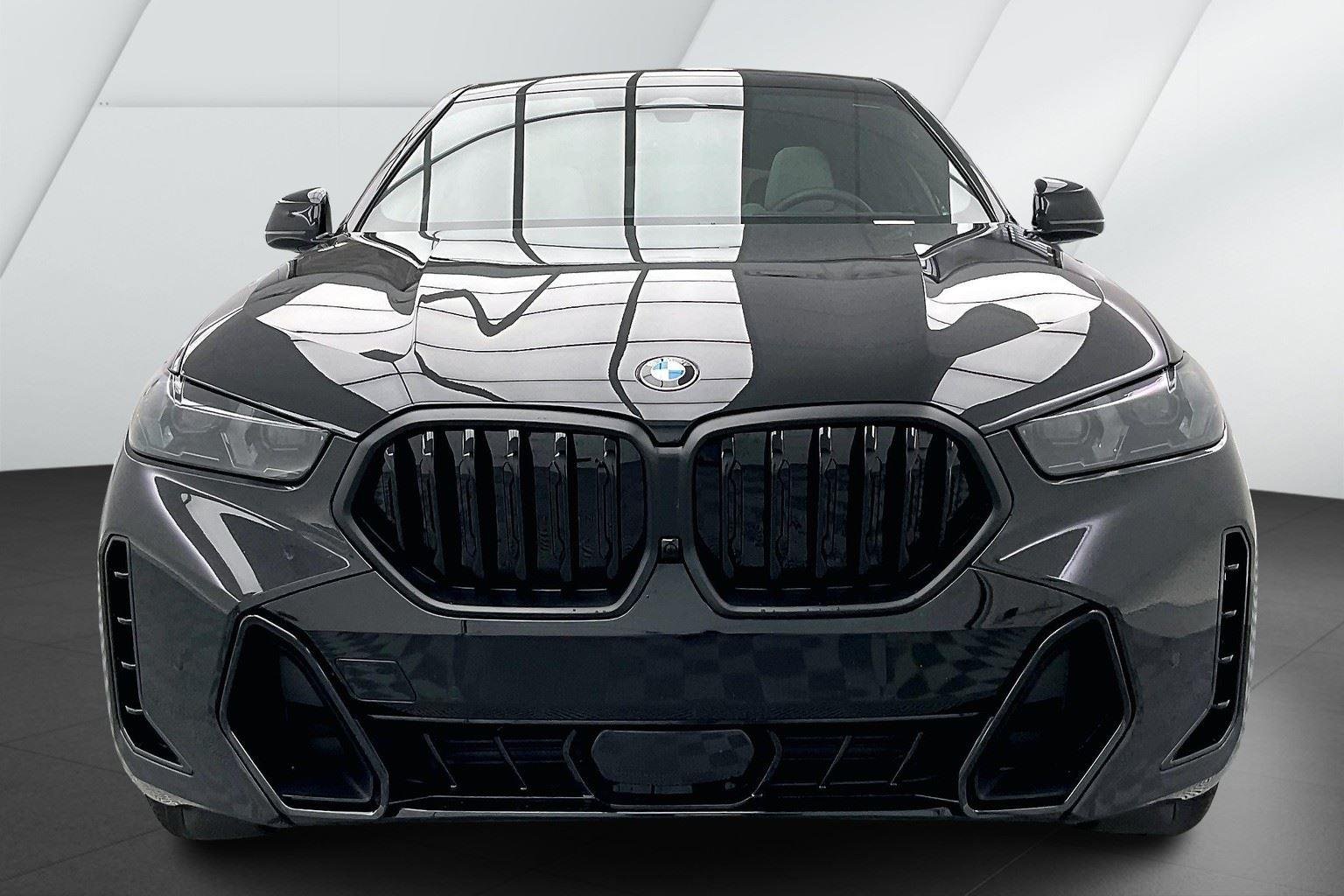 Certified Used 2025 Black Sapphire Metallic BMW xDrive40i image 2