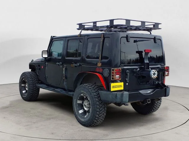 Used 2012 Black Jeep Unlimited Sahara Altitude image 3