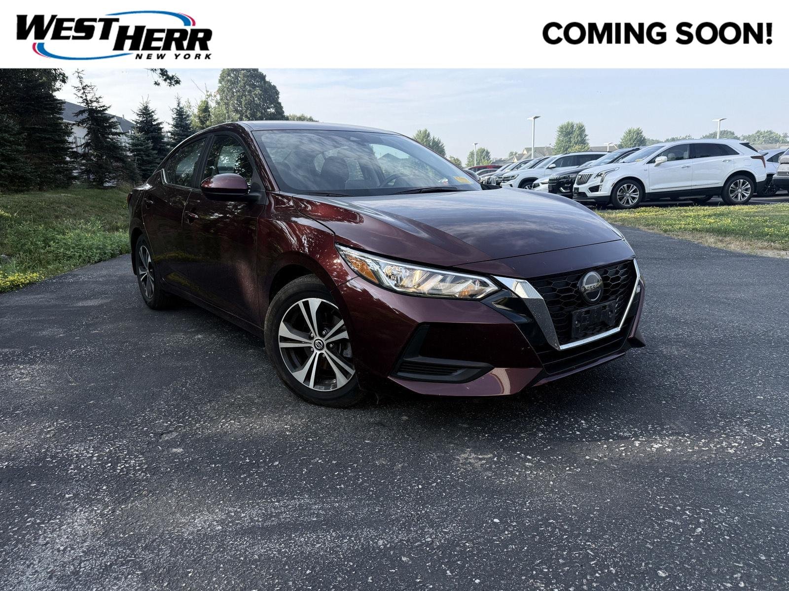 Used 2023 Rosewood Metallic Nissan SV image 1