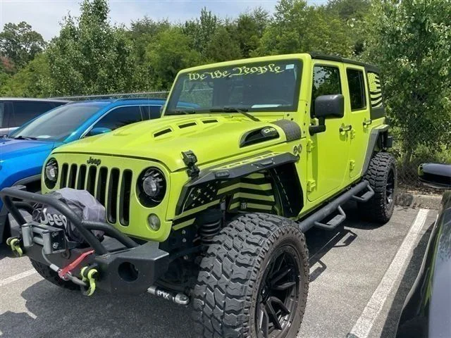 Used 2016 Green Jeep Unlimited Sahara image 1