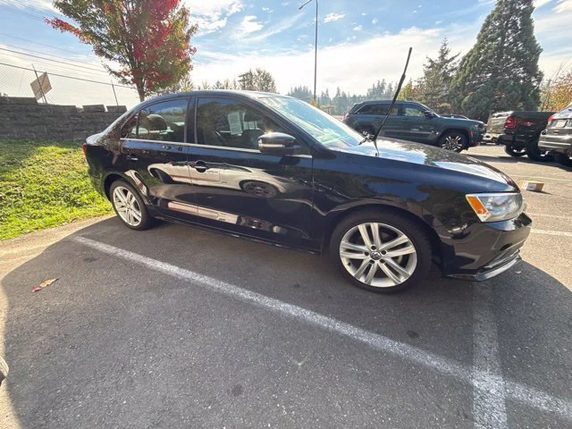 Used 2015 Black Volkswagen 2.0L TDI SEL image 1