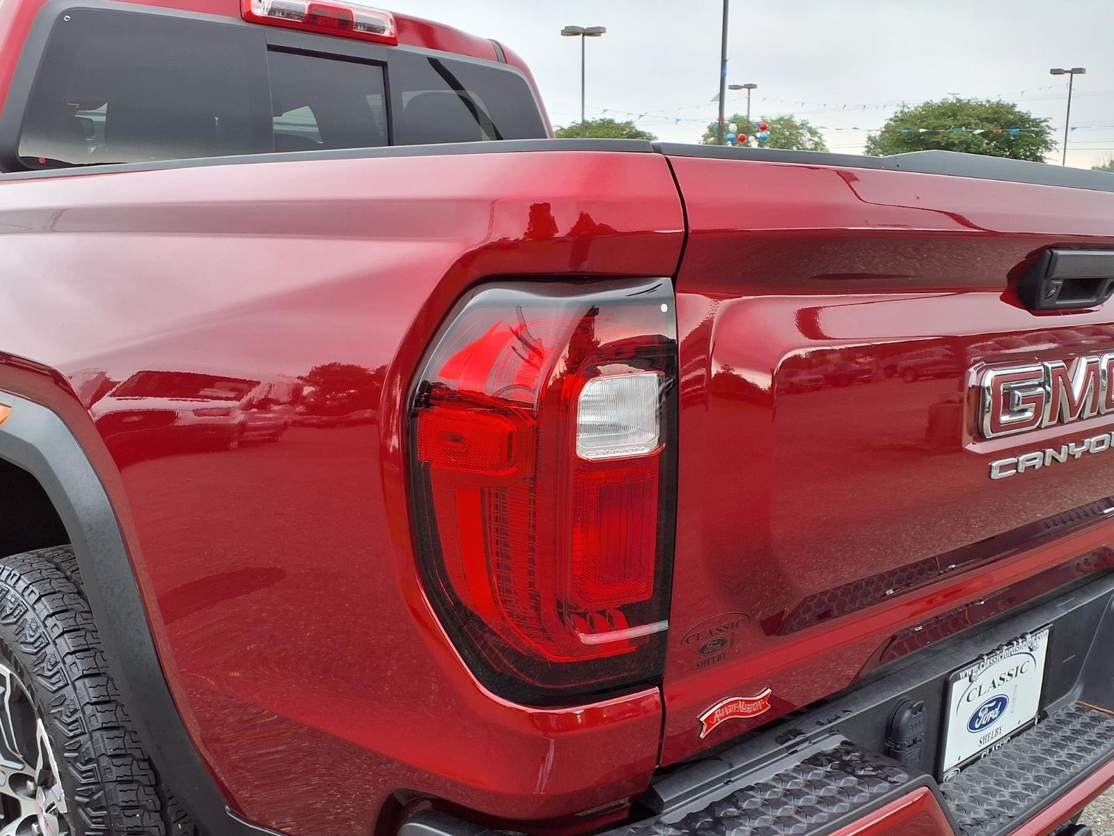 Used 2025 Volcanic Red Tintcoat GMC 4WD AT4 image 17