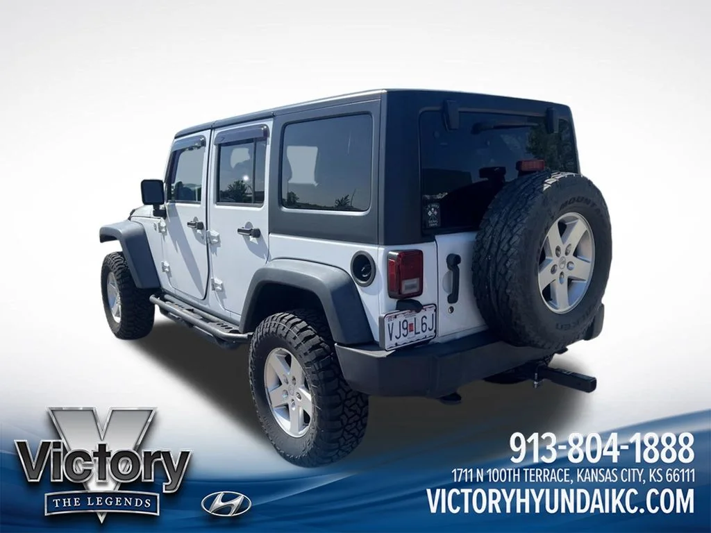 Used 2013 White Jeep Unlimited Sport image 7