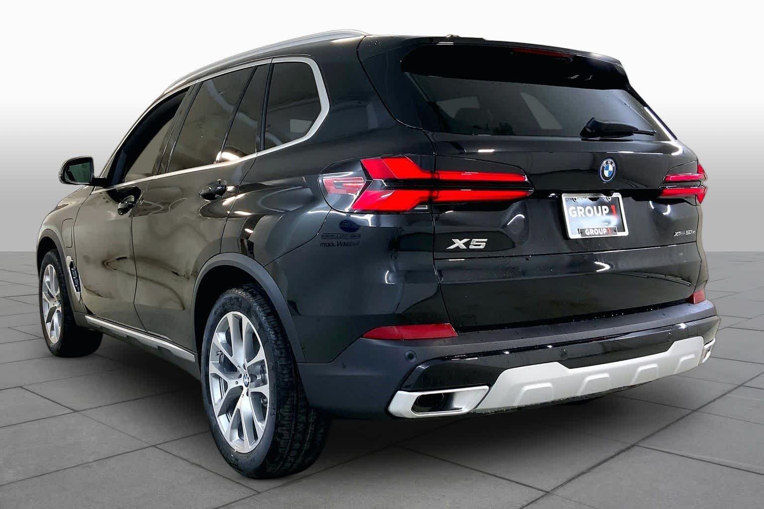 New 2026 Black Sapphire Metallic BMW xDrive50e image 12