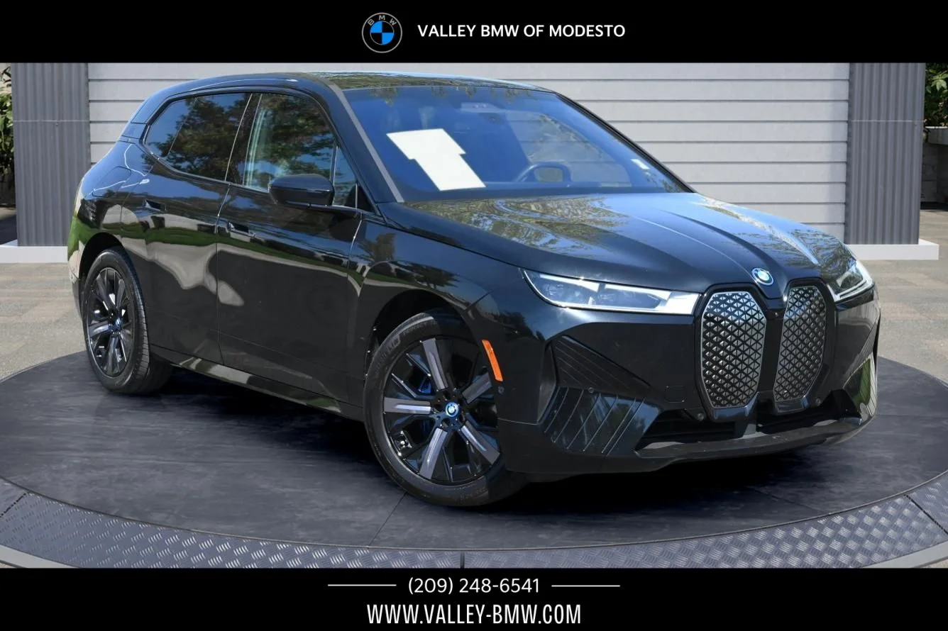 Used 2024 Black Sapphire Metallic BMW xDrive50 image 1