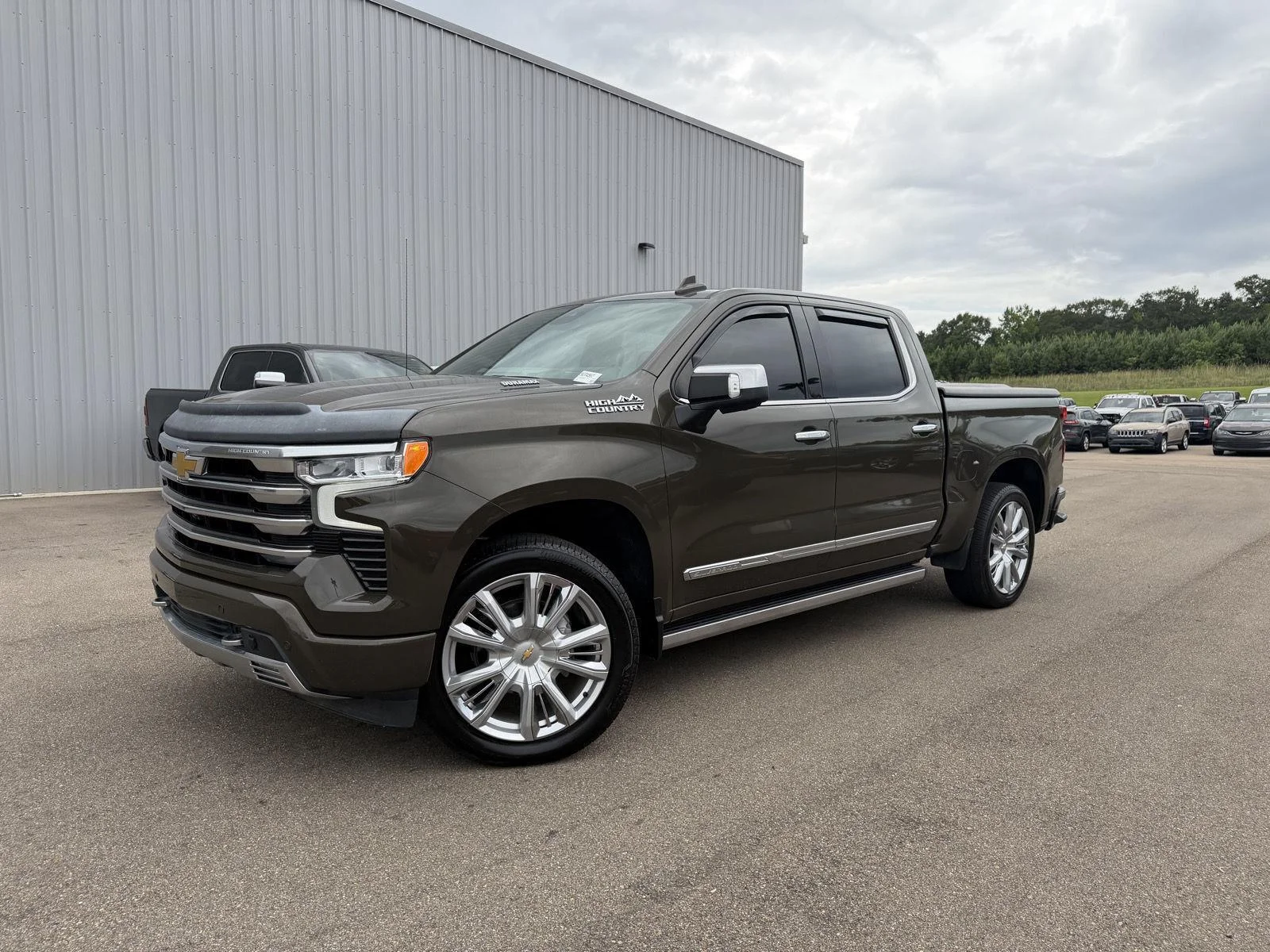 Used 2023 Harvest Bronze Metallic Chevrolet High Country image 1