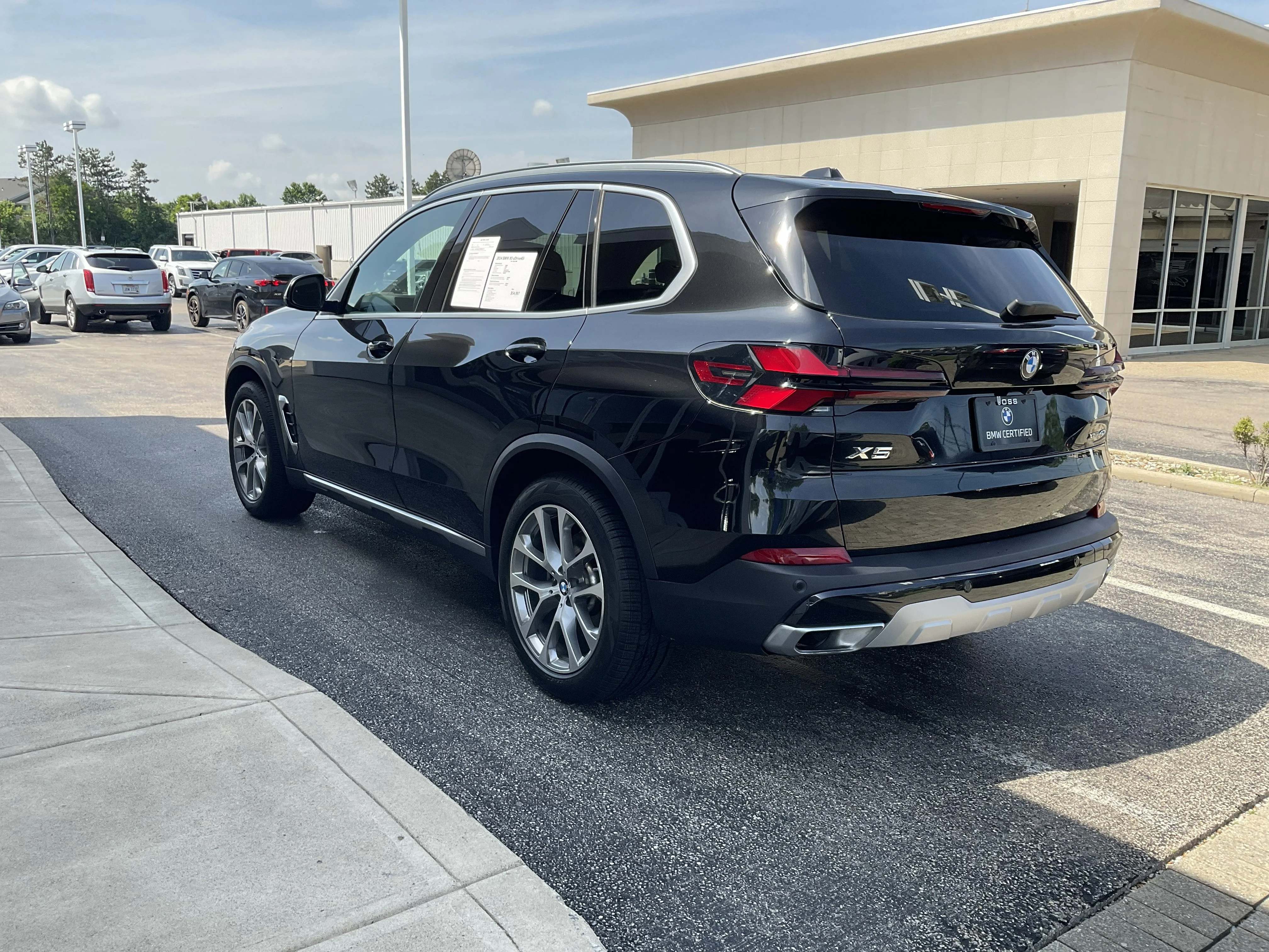 Certified Used 2024 Black Sapphire Metallic BMW xDrive40i image 5