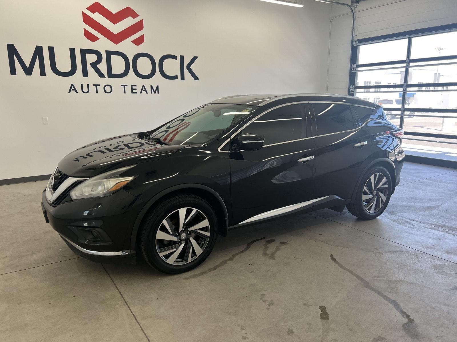 Used 2015 Magnetic Black Metallic Nissan Platinum image 1