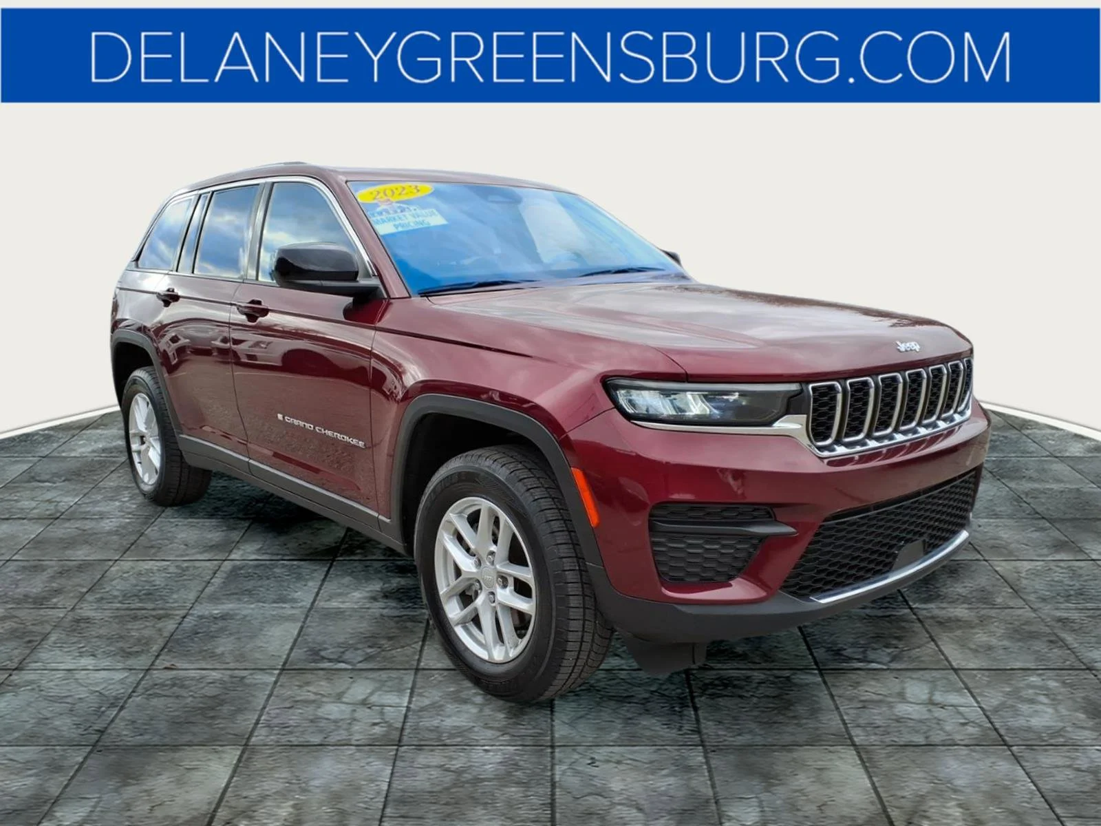 Used 2023 Velvet Red Pearlcoat Jeep Laredo image 1