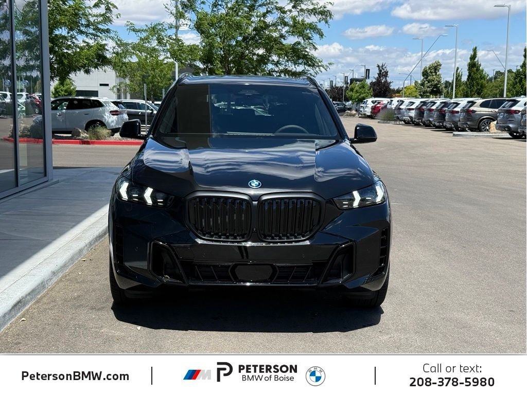 New 2026 Black Sapphire Metallic BMW xDrive50e image 8