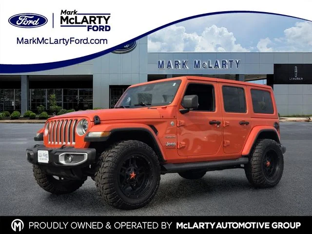 Used 2020 Orange Jeep Unlimited Sahara image 1