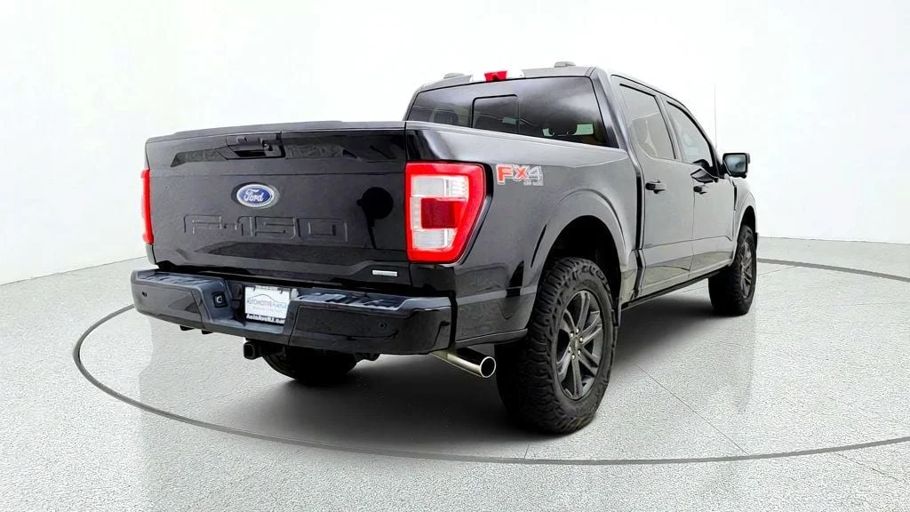 Used 2023 Agate Black Metallic Ford LARIAT 4WD SuperCrew 5.5