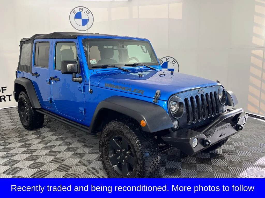 Used 2016 Blue Pearl Jeep Unlimited Sport image 1