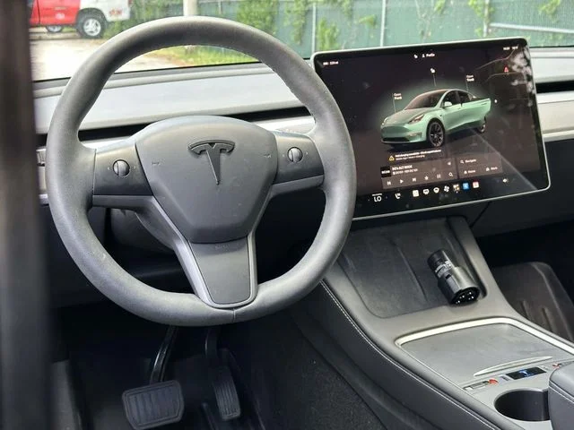 Used 2023 Tesla Model Y Long Range with VIN 7SAYGDEE4PF697200 for sale in Glen Burnie, MD