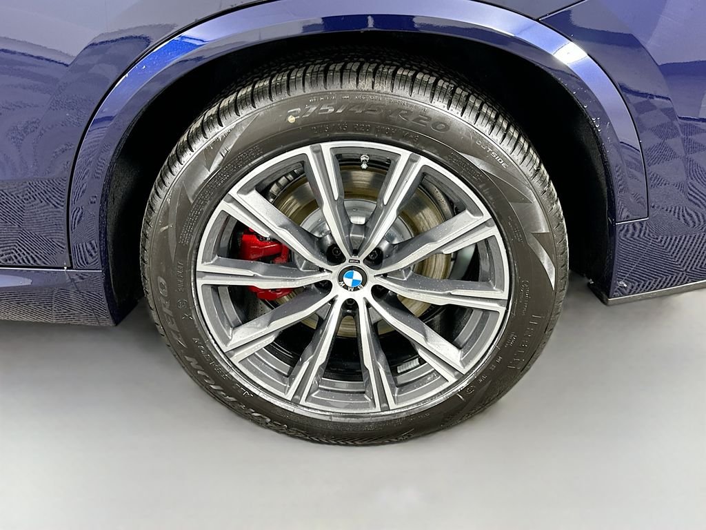 Used 2026 Tanzanite Blue II Metallic BMW xDrive50e image 23