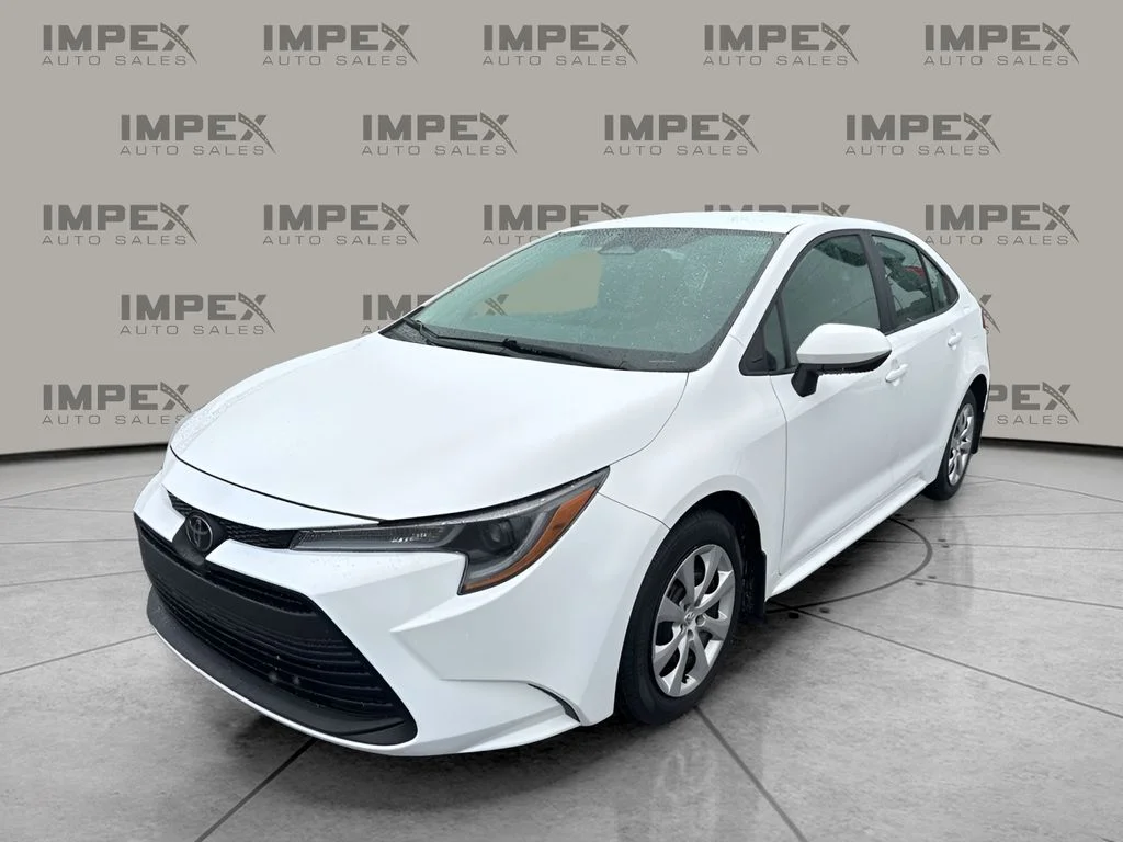 Used 2025 White Toyota LE image 1