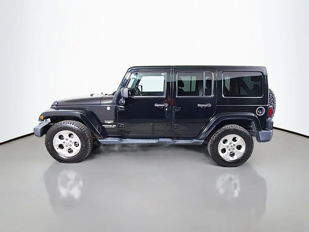 Used 2015 Black Jeep Unlimited Sahara image 9
